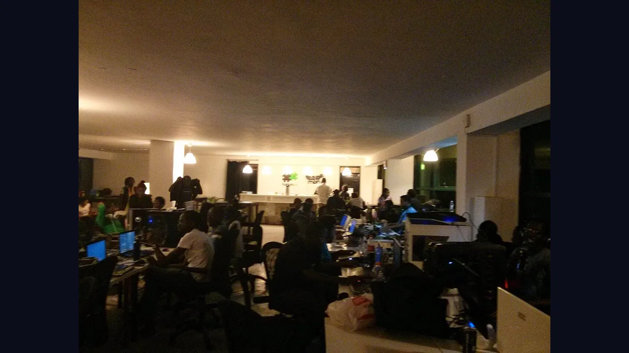 A gaming team gathered around computers