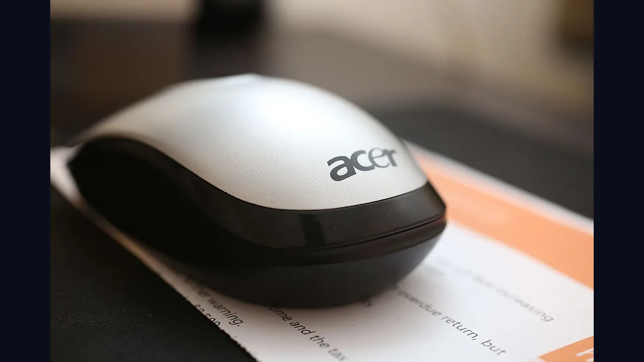 A gaming computer mouse on a desk close up
